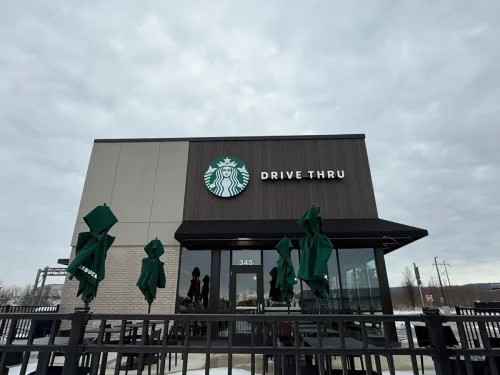 Photo of a Starbucks building with EIFS, thin brick, and fiber cement exterior cladding installed