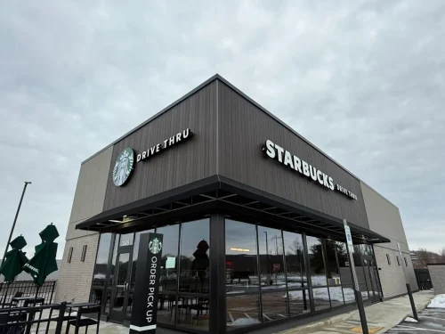 Photo of a Starbucks building with EIFS, thin brick, and fiber cement exterior cladding installed