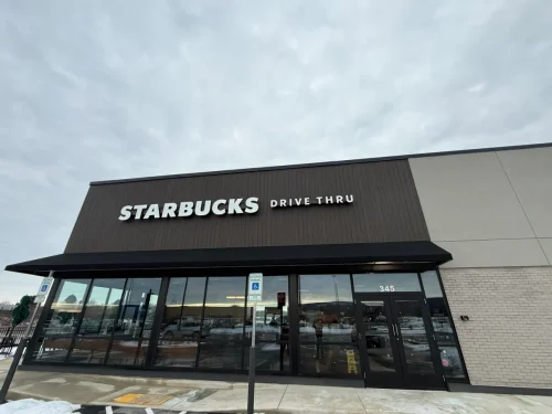 Photo of a Starbucks building with EIFS, thin brick, and fiber cement exterior cladding installed